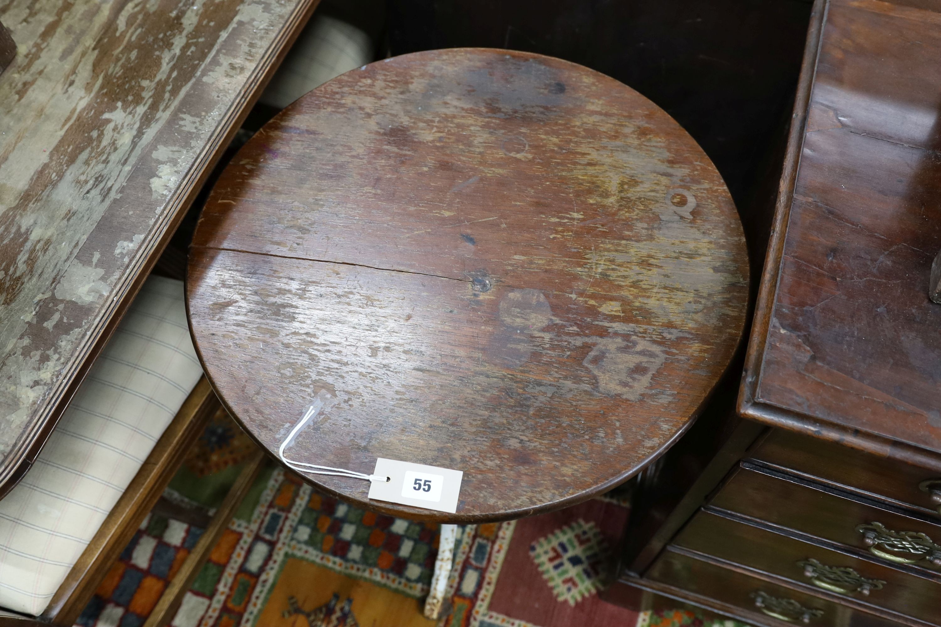 A Victorian cast iron tripod pub table with circular mahogany top, diameter 53cm, height 71cm